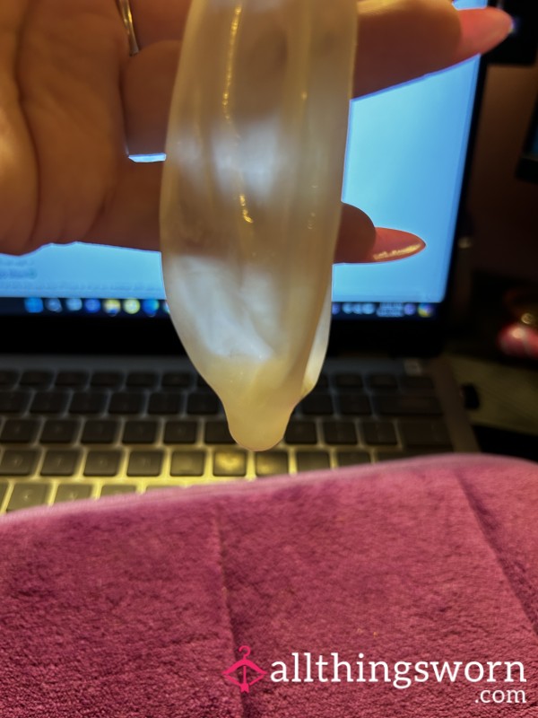 Alpha C*m Filled Condom