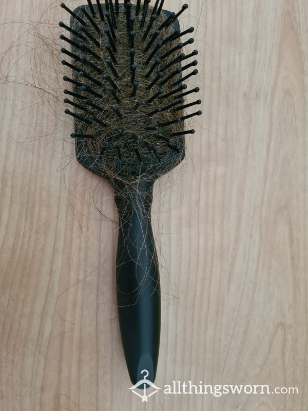 Black Hairbrush And Hair