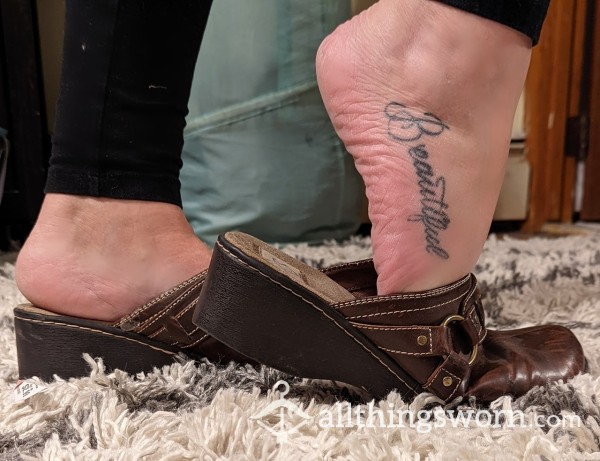 Well Worn Brown Leather Clogs