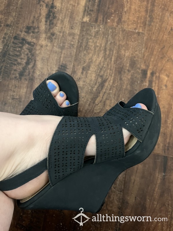 Feet In Black Wedges