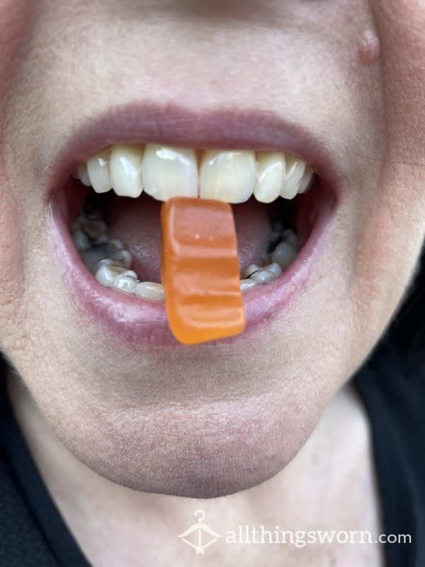 Mouth Close Up Of 2 Sister’s Eating Lollies