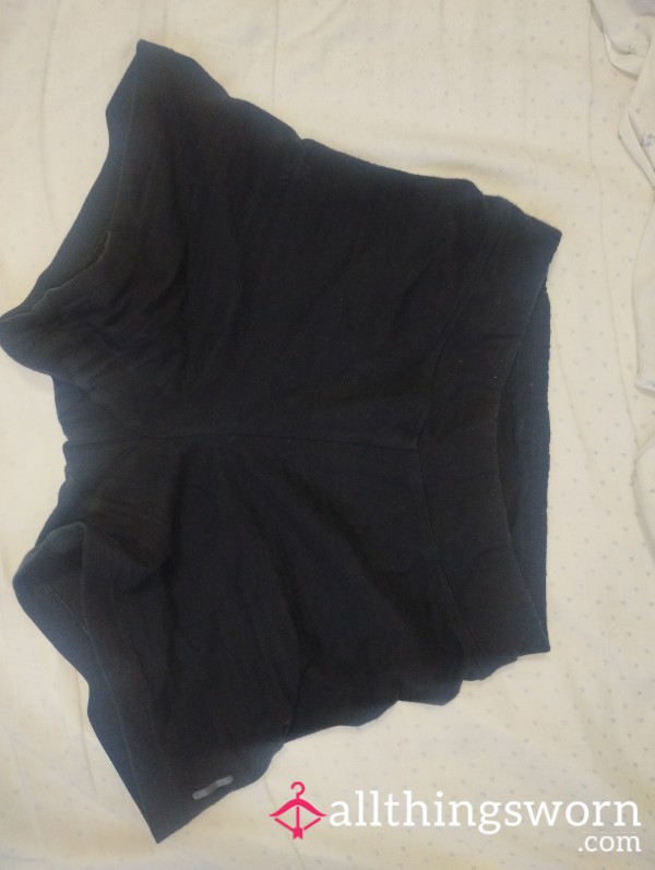 Short Sweaty Black Leggings Used During Workout