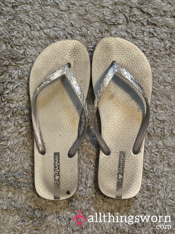 Well-loved Dirty Silver Flip-Flops