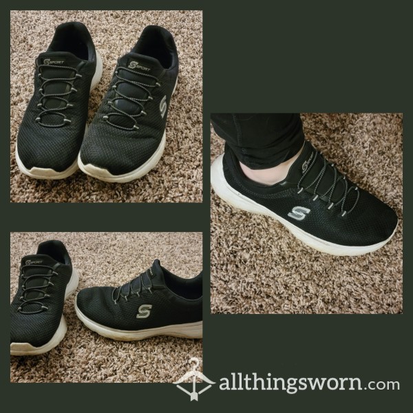 Well-worn Black Sketchers Sneakers