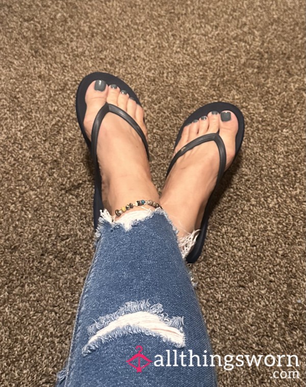 Well-worn Hollister Flip Flops