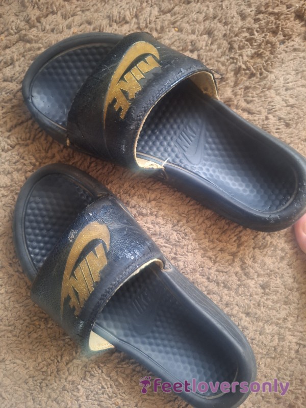 Well-worn Nike Slides